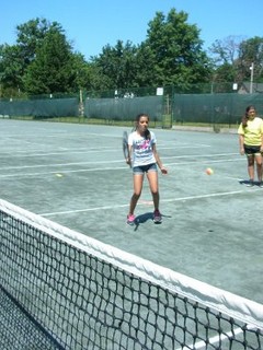 boy playing tennis