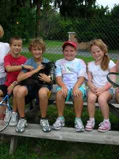 small group of kids sitting on bench